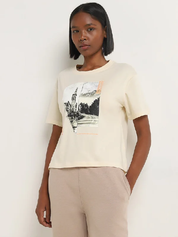 Effortlessly chic outfits for the modern woman   Studiofit Light Beige Cityscape Design Cotton T-Shirt